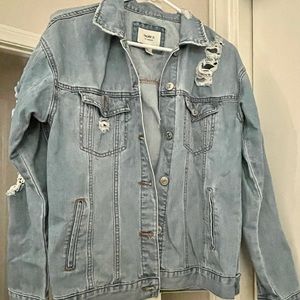 Distressed oversized denim jacket